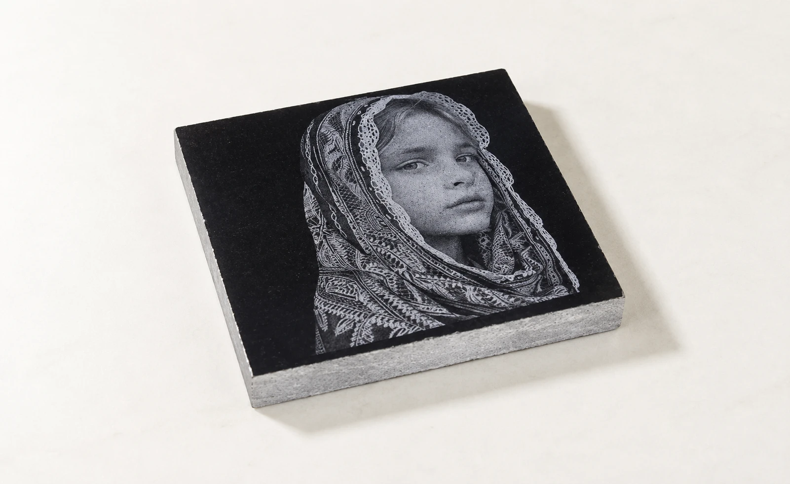laser engraved girl's pic on marble with CO₂ laser. laser engraved girl's pic on marble with CO₂ laser.